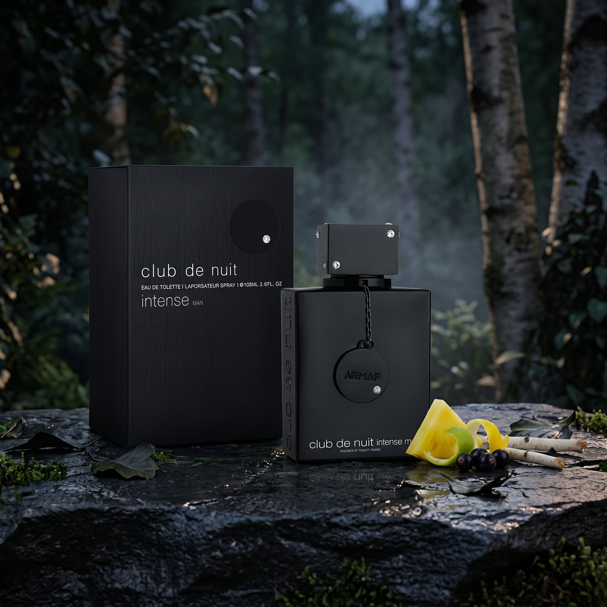 Club de Nuit Intense Eau de Toilette bottle and its black packaging box, styled on a wet dark stone surface with a slice of lemon, a cigar, and dark berries, set against a misty, dark forest background.