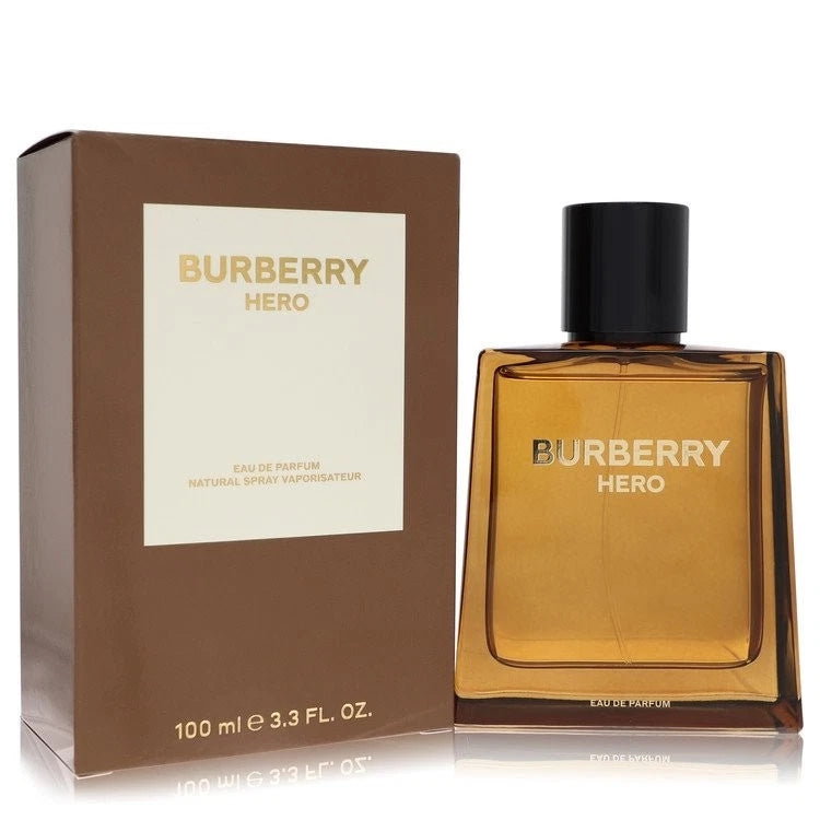 Burberry Hero Eau de Parfum bottle in amber glass with a black cap next to its brown packaging box with a white label.
