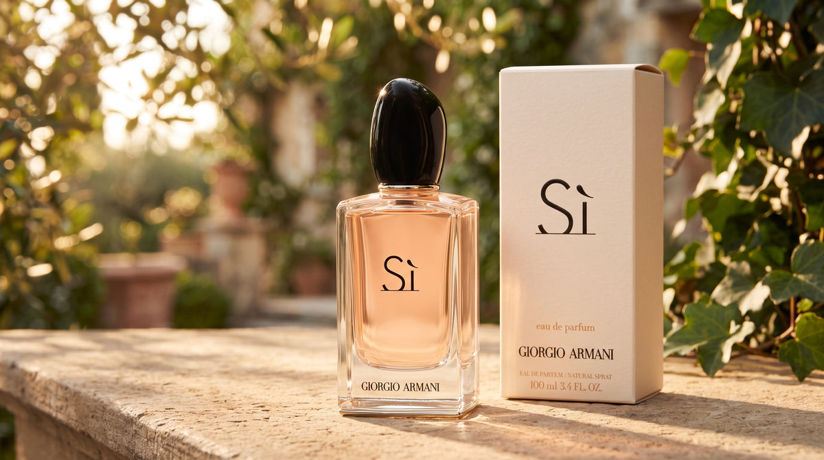 Giorgio Armani Si perfume bottle and its packaging box placed on a stone ledge with a blurred garden background.