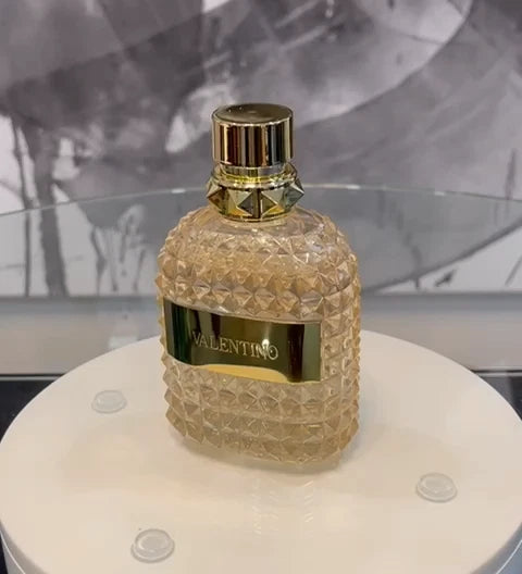 Valentino perfume bottle on a white surface with a blurred background